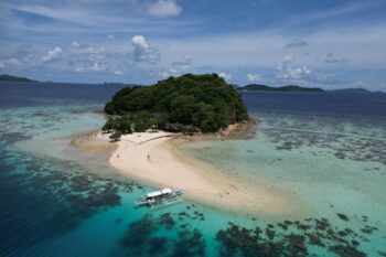 Bamboo Private Island in Palawan, Philippines, an exclusive luxury beachfront retreat with pristine white sand, turquoise waters, and eco-friendly villas surrounded by nature.