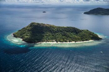 Aerial view of Ariara Private Island for rent in Palawan, a luxury private island for rent with white sand beaches, turquoise waters, and exclusive beachfront villas.