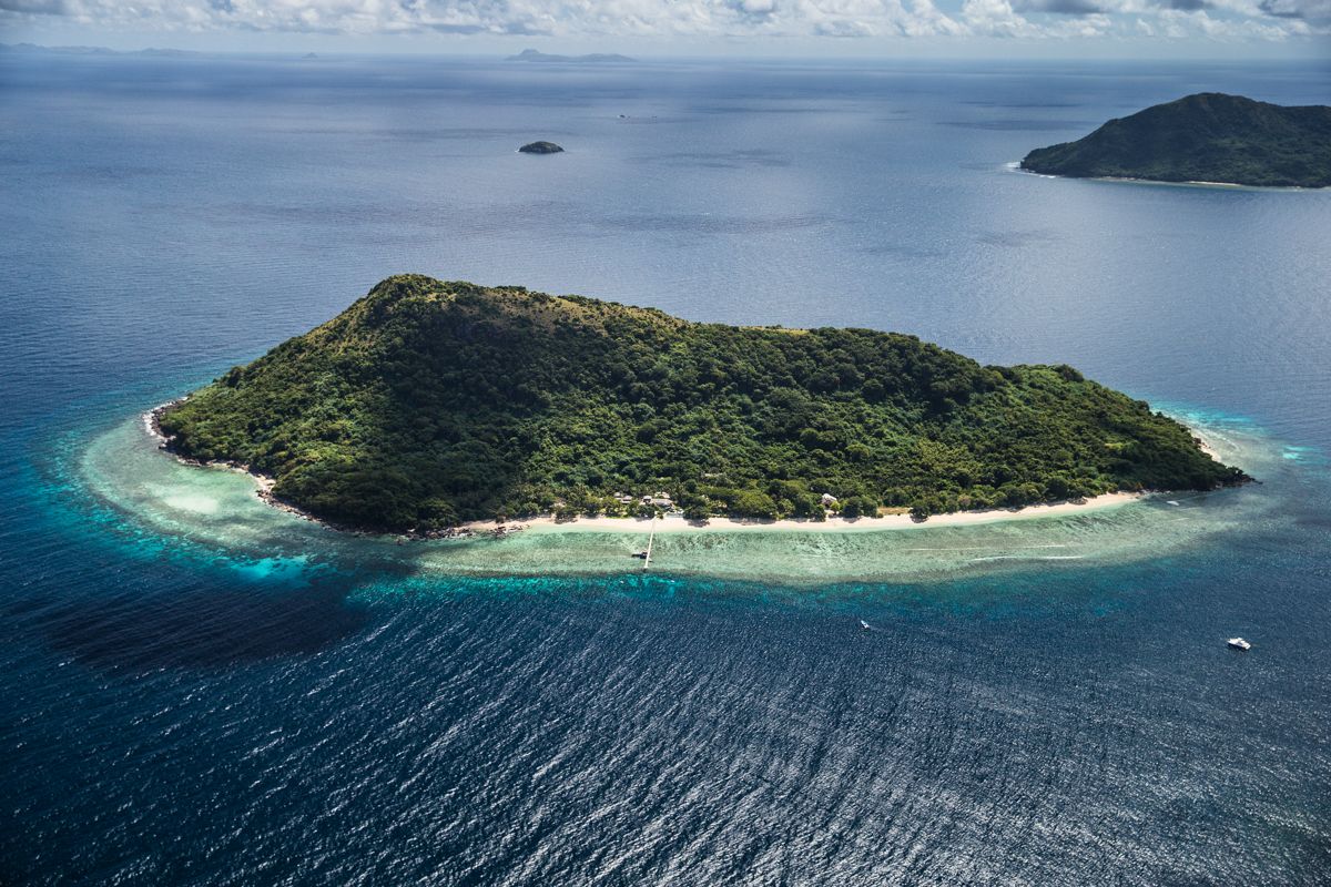 Aerial view of Ariara Private Island for rent in Palawan, a luxury private island for rent with white sand beaches, turquoise waters, and exclusive beachfront villas.