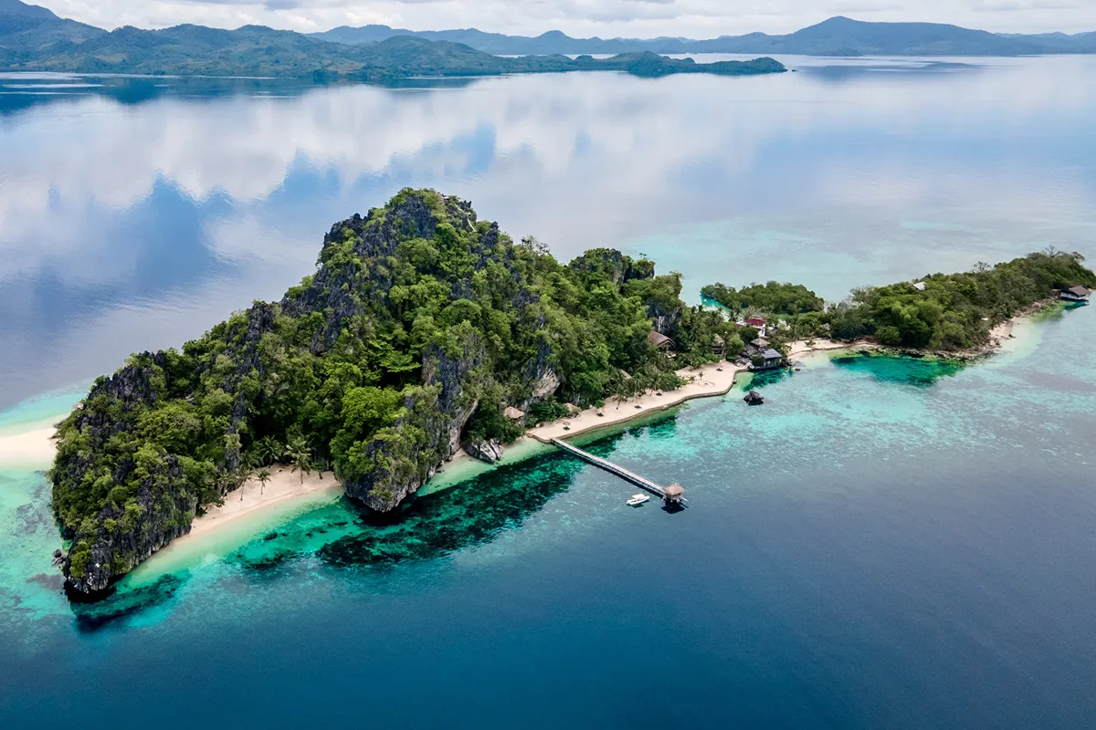 Aerial shot of Floral Island Resort, featuring the prestine waters surrounding this breathtaking island in Palawan.