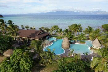 Two Seasons Coron Island Resort in Palawan, a luxury island resort in Coron featuring white-sand beaches, crystal-clear waters, tropical villas, and lush scenery on Bulalacao Island.