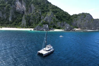 Private yacht charter in the Philippines cruising through turquoise island waters