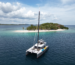 Sunreef 60 cruising through Pass Island, best catamarans for charter in Palawan.